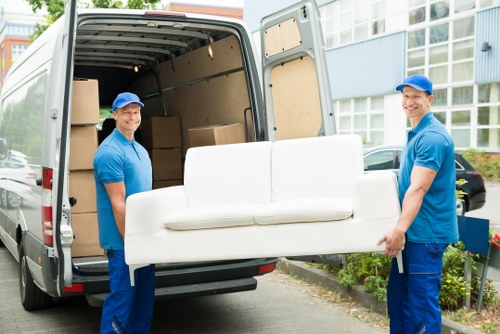 Removal team planning a move in a West Kensington residential street