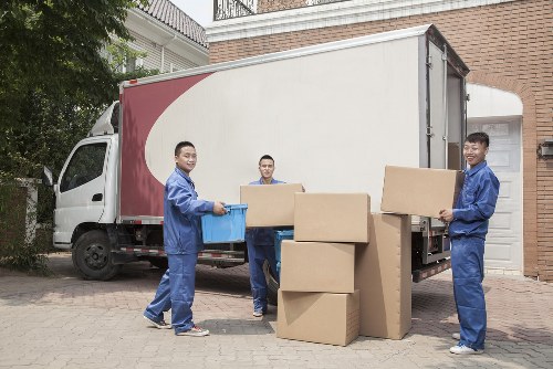 Furniture and boxes being loaded into a van for a West Kensington job