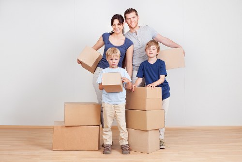 Furniture and boxes being handled in a West Kensington property