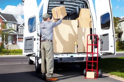 Local removals van loading items for a West Kensington house move