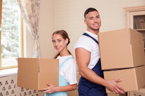 Unpacking household items in a West Kensington flat after a move