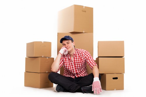 Mover handling furniture carefully during a Westkensington van service